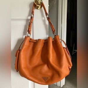 Prada authentic Vitello Daino Drawstring Bucket in orange